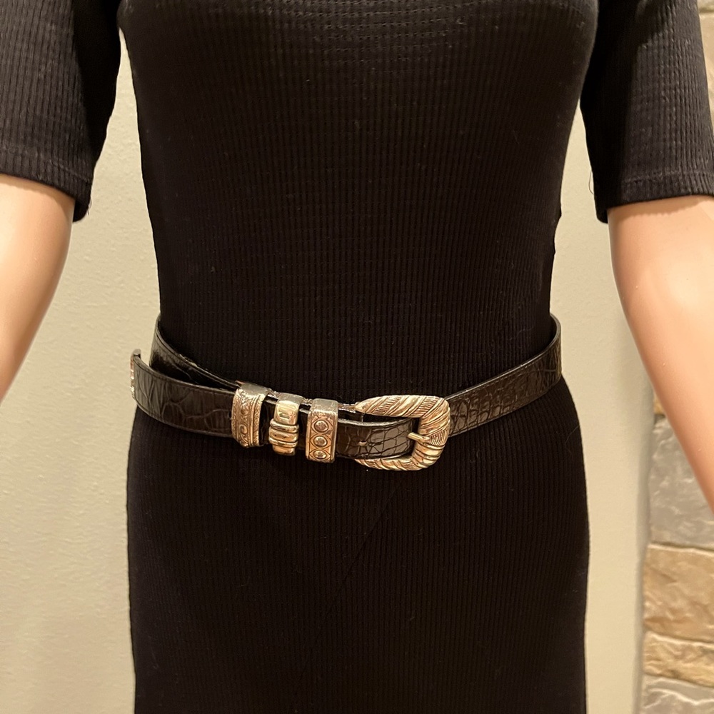 Black leather belt with silver buckle and embellishments